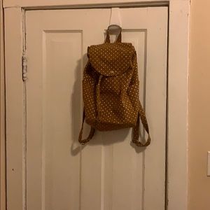 Green polka dot backpack